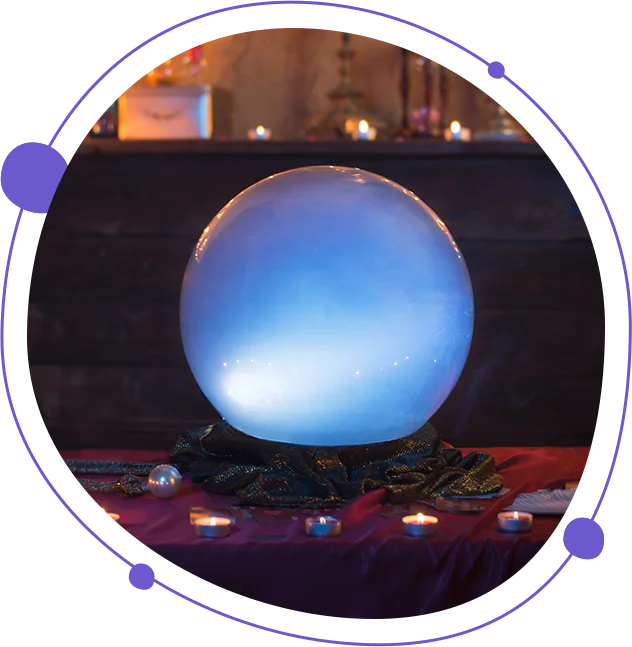 A blue crystal ball sitting on top of a table.