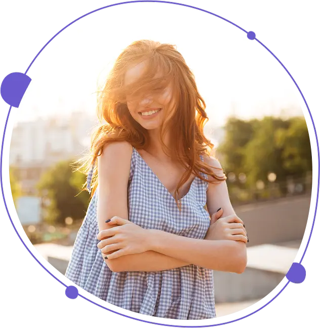 Woman with red hair folded arms in blue blouse