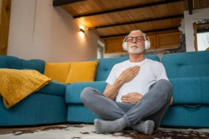 Man reflecting holding heart