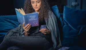 Woman readings Stars an Destiny book