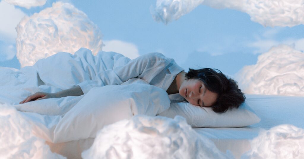 Woman sleeping in clouds