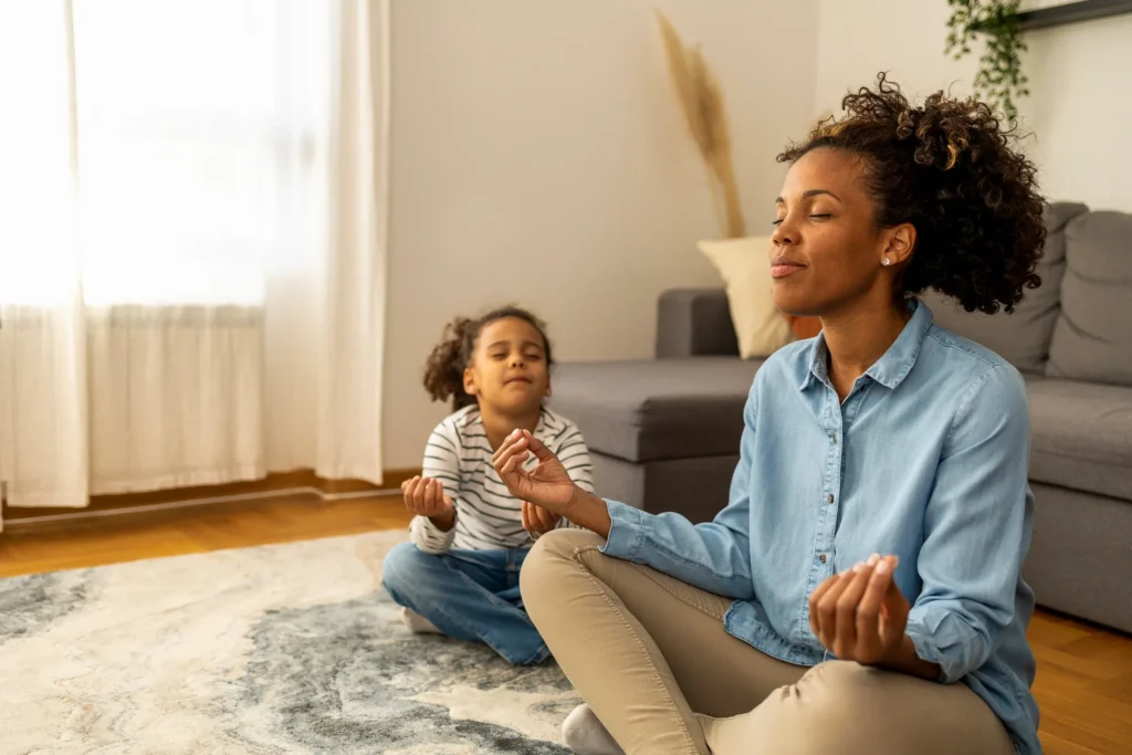 Mom and Daughter Meditating